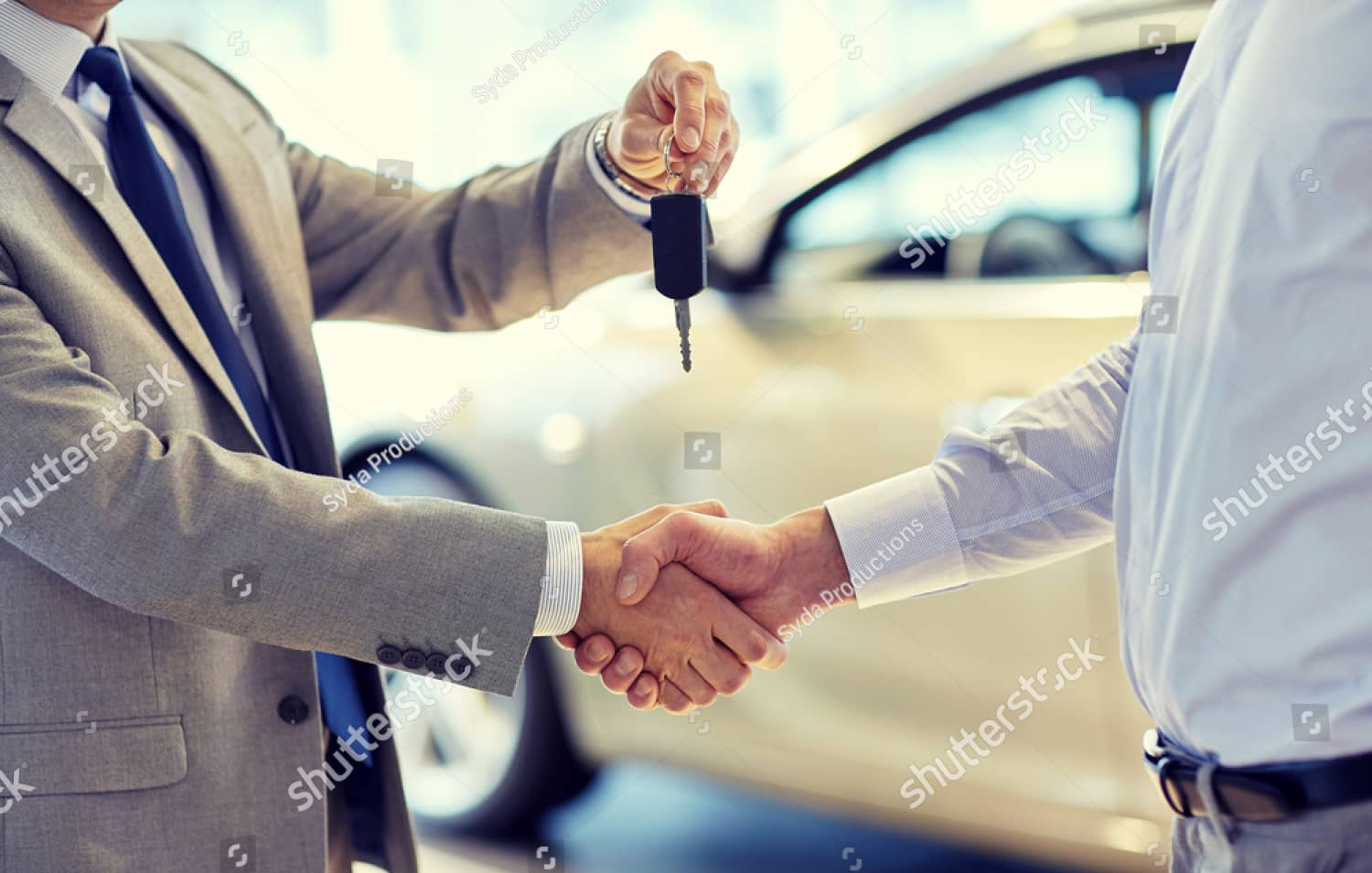 stock-photo-auto-business-car-sale-deal-gesture-and-people-concept-close-up-of-dealer-giving-key-to-new-394138174